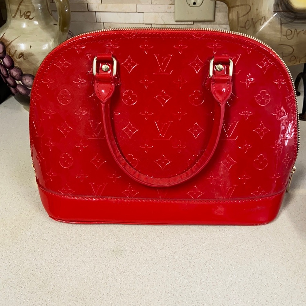 New red patent handbag